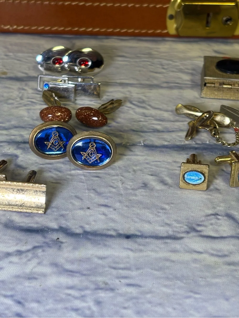 Mid century jewelry box with all the jewelry seen in pictures. Cuff links, tie
